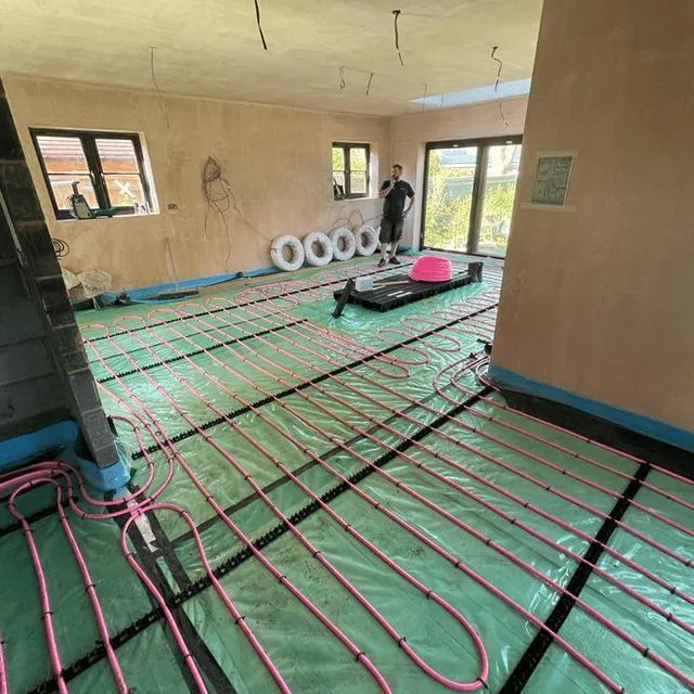 Underfloor heating pipework laid out across a floor