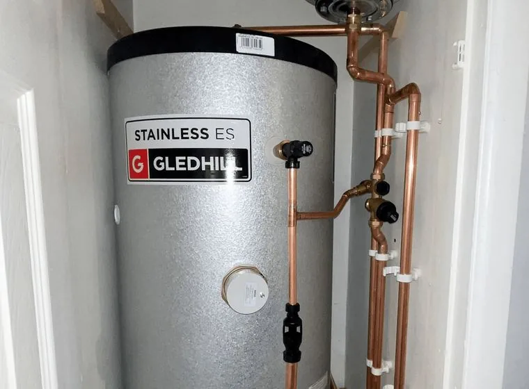 A hot water cylinder and boiler with new copper pipework
